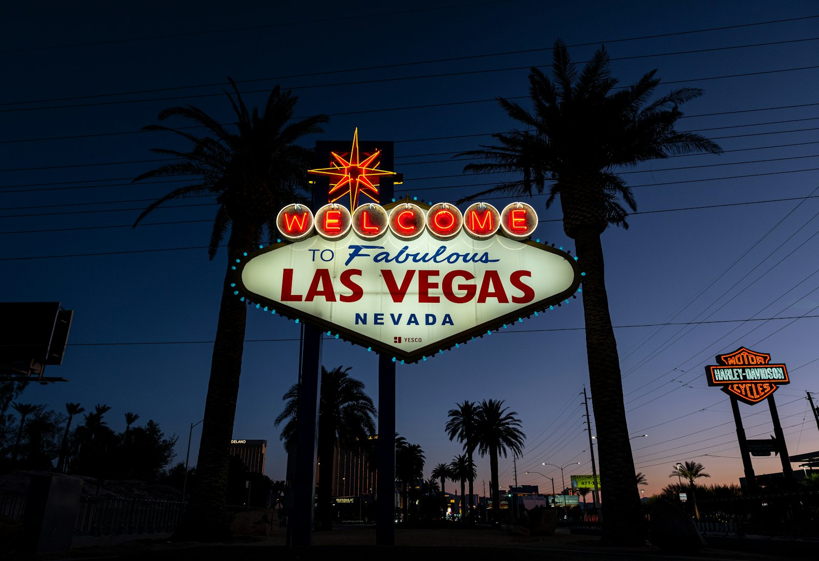 The illuminated Welcome to Fabulous Las Vegas neon sign glowing against the night sky