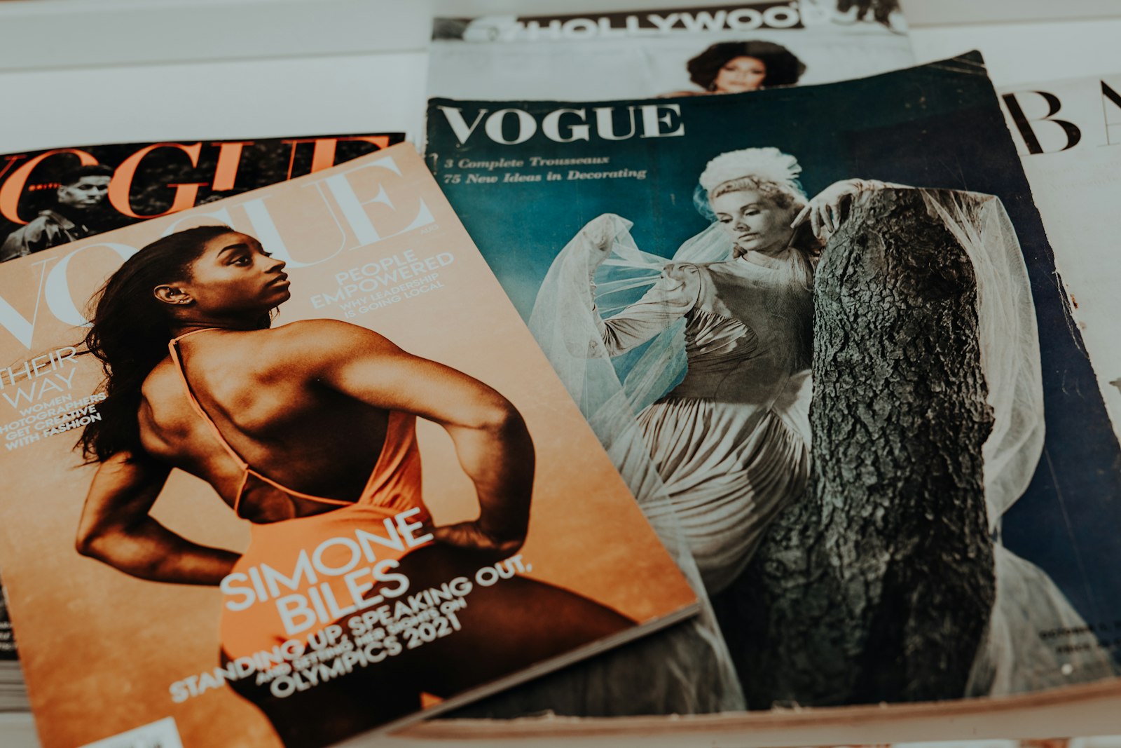 A pile of glossy magazines lying on a table